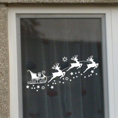 Karácsonyi ablakmatrica szarvashúzta szánnal és csillagokkal